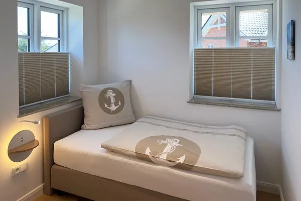 Schlafzimmer Haus Dünenperle Ferienwohnung "Dünengras"