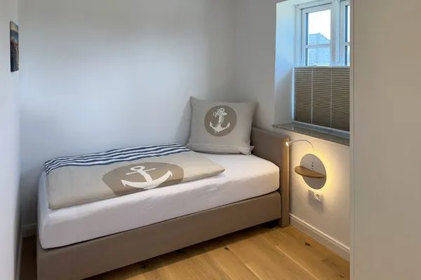 Schlafzimmer Haus Dünenperle Ferienwohnung "Dünengras"