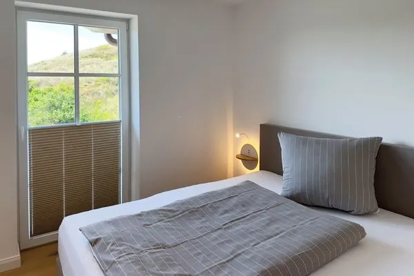 Schlafzimmer Haus Dünenperle Ferienwohnung "Wanderdüne"