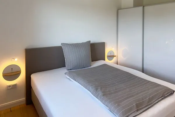 Schlafzimmer Haus Dünenperle Ferienwohnung "Wanderdüne"