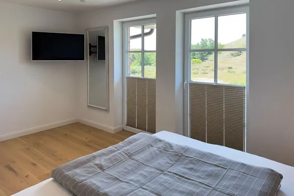 Schlafzimmer Haus Dünenperle Ferienwohnung "Wanderdüne"