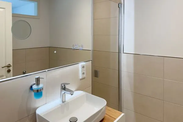 Badezimmer Haus Dünenperle Ferienwohnung "Wanderdüne"