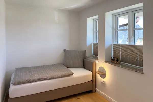 Schlafzimmer Haus Dünenperle Ferienwohnung "Wanderdüne"