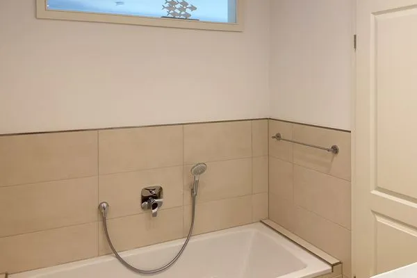 Badezimmer Haus Dünenperle Ferienwohnung "Wanderdüne"