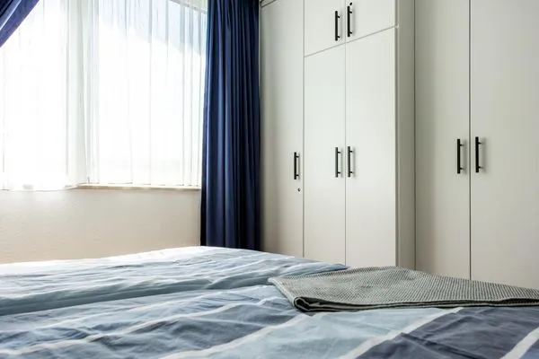 Schlafzimmer mit Doppelbett Residenz am Strand Wohnung 6-80
