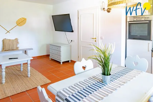 Wohnzimmer Ferienhaus am Gutspark Dranske Ferienwohnung Küstenklee