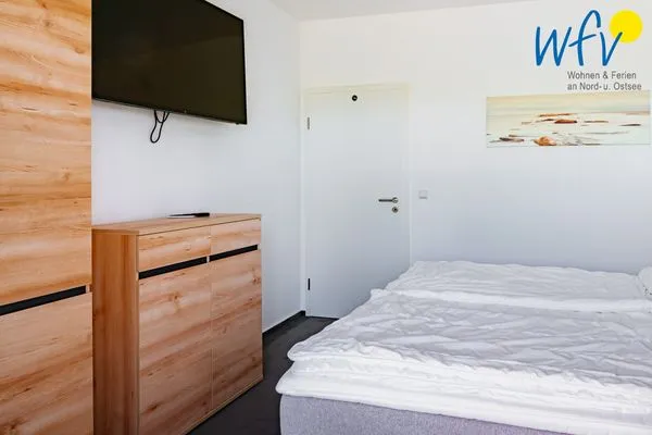 Schlafzimmer Ferienhaus am Gutspark Dranske Ferienwohnung Sonnentag