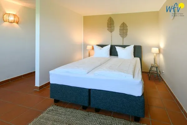 Schlafzimmer Ferienhaus am Gutspark Dranske Ferienwohnung Sonnenhut