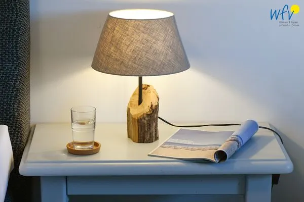 Schlafzimmer Ferienhaus am Gutspark Dranske Ferienwohnungen Sonnenaufgang und Sonnentag