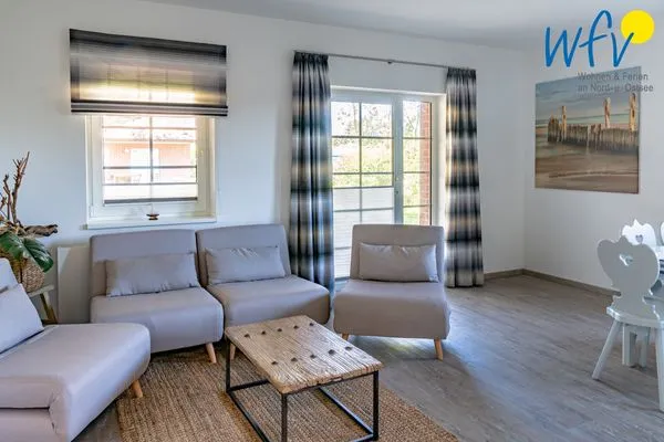 Wohnzimmer Ferienhaus am Gutspark Dranske Ferienwohnungen Sonnenaufgang und Sonnentag