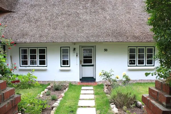 Friesenhaus Amrum mit der Friesenhaushälfte "Klönschnack"in Süddorf auf Amrum Friesenhaus Amrum Ferienhaushälfte „Klönschnack"