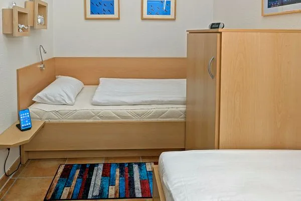 Schlafzimmer mit zwei Einzelbetten Residenz am Strand Wohnung 2-46