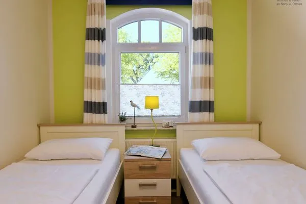 Schlafzimmer Villa Kranich Ferienwohnung 1