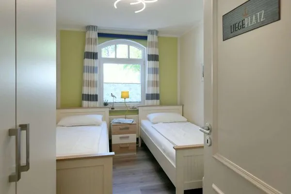 Schlafzimmer Villa Kranich Ferienwohnung 1