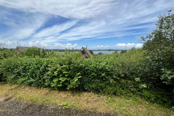   Modernes Nurdachhaus in ruhiger Feriensiedlung direkt am Wittensee mit Seeblick