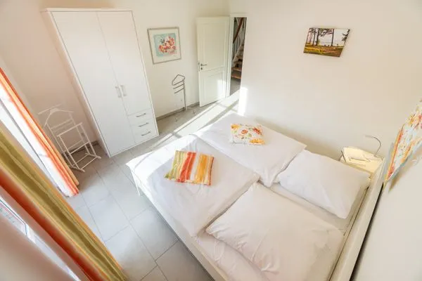 Schlafzimmer  Ferienhaus am Dünenwald