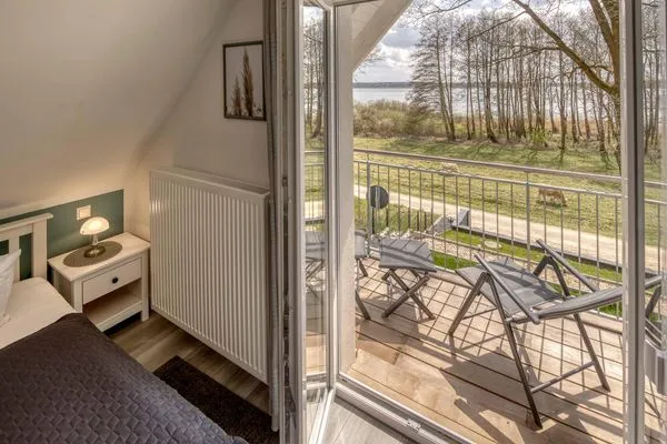 Seezauber Sietow Einfamilienhaus Schlafzimmer mit Balkon  SeeZauber