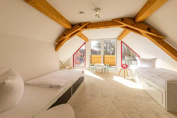 Ferienwohnung City Apartement Waren (Müritz) - Schlafzimmer mit Altstadt-Flair  City Apartment