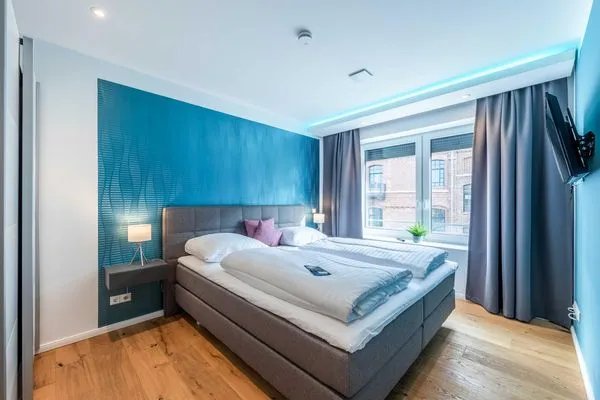 Ferienwohnung Inselsuite Malchow Blick in eines der Schlafzimmer mit Doppelbett  Inselsuite