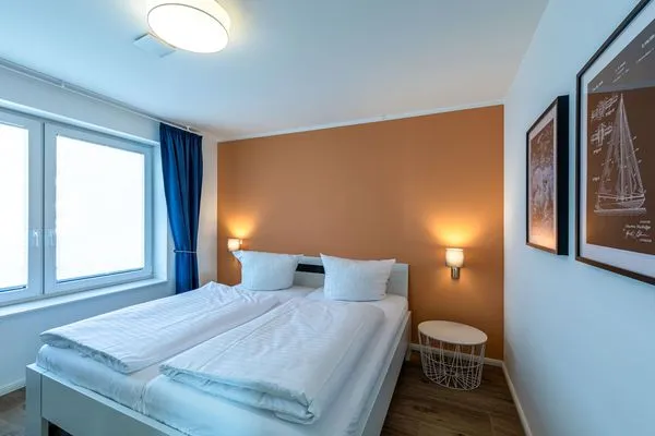 Ferienwohnung Wasserlilie Malchow Schlafzimmer mit Doppelbett  Wasserlilie