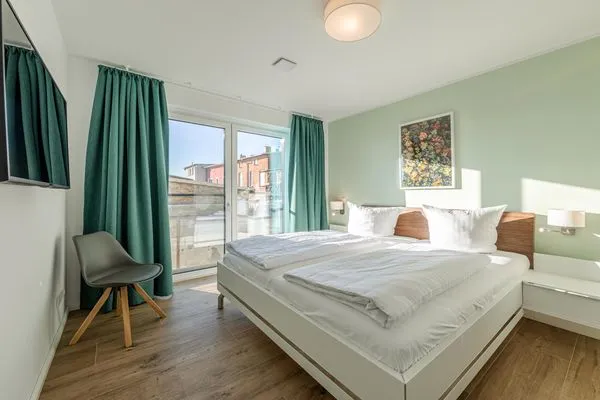 Ferienwohnung Wasserlilie Malchow Blick in eines der Schlafzimmer  Wasserlilie