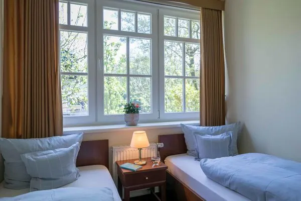Schlafzimmer Gästehaus Orion - Wohnung 1