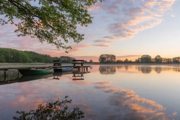 Ferienwohnung Schwan Sonnenuntergang über dem Loppiner See  Schwan