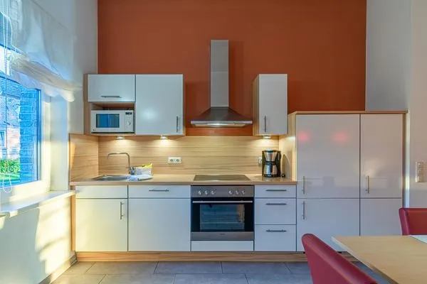 Ferienwohnung Haubentaucher Blick auf die offene Küche  Haubentaucher