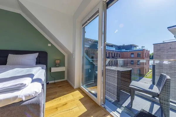 Ferienwohnung SeeGlück Schlafzimmer mit Zugang zum Balkon  SeeGlück