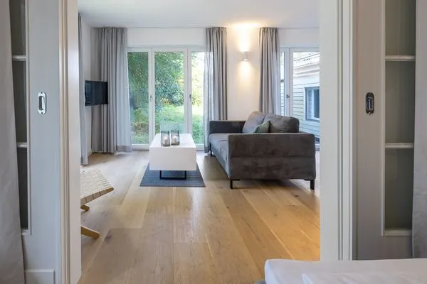 Wohnzimmer Haffperle Meerblau - zentral in Haffkrug, nur wenige Schritte zum Strand