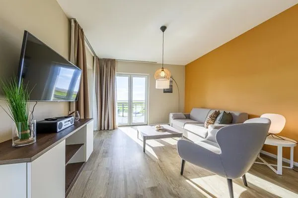 Ferienwohnung Boddenstuv Ostseebad Wustrow - ZweiWasser Alte Seefahrtschule Wohnzimmer  Boddenstuv