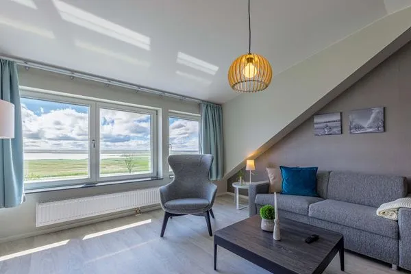 Ferienwohnung Seebadperle Ostseebad Wustrow ZweiWasser Alte Seefahrtschule Wohnzimmer mit Wasserblick  Seebadperle