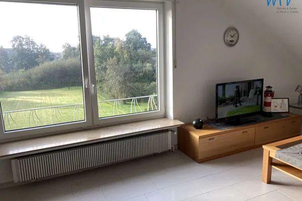 Wohnzimmer Ferienhaus Kiebitzdelle-Leegde 10 Ferienwohnung Backhaus