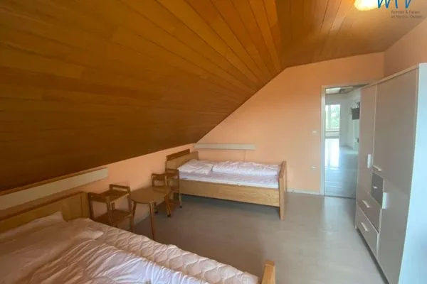 Schlafzimmer Ferienhaus Kiebitzdelle-Leegde 10 Ferienwohnung Backhaus