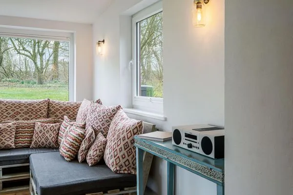 Wintergarten mit Meerblick, neben dem Wohnzimmer  Bauernhaus am Mühlendamm