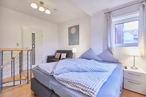 Schlafzimmer  Haus am Leuchtturm - Ferienwohnung Sonne