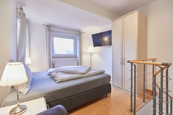 Schlafzimmer  Haus am Leuchtturm - Ferienwohnung Sonne