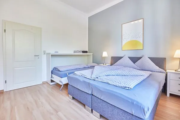 Schlafzimmer  Haus am Leuchtturm - Ferienwohnung Mond