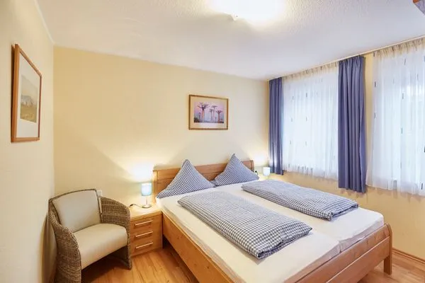Schlafzimmer  Haus Inselherz - Ferienwohnung Muschel