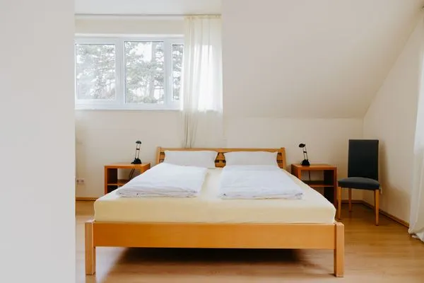 Schlafzimmer  Ferienhaus Hilde am Wald