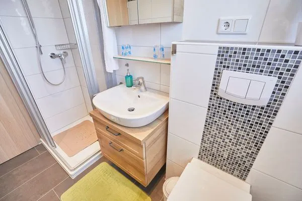 Badezimmer  Haus Seute Deern - Ferienwohnung 1 - Muschel