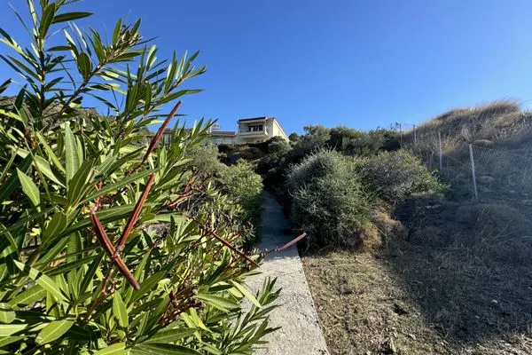 Path to the rocky plateau and beach cove  Orestis
