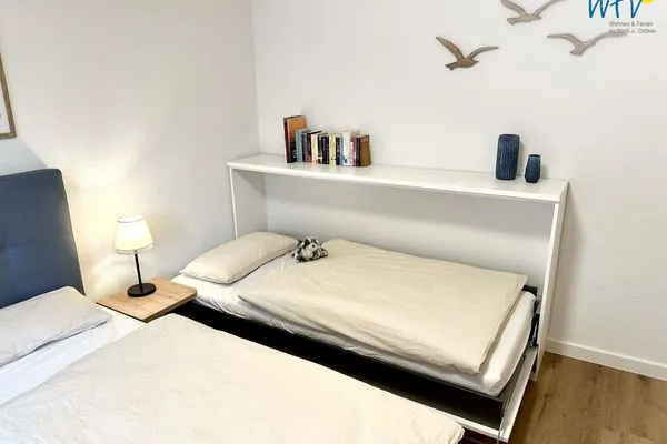 Schlafzimmer Haus Dünenrose Ferienwohnung Seehund