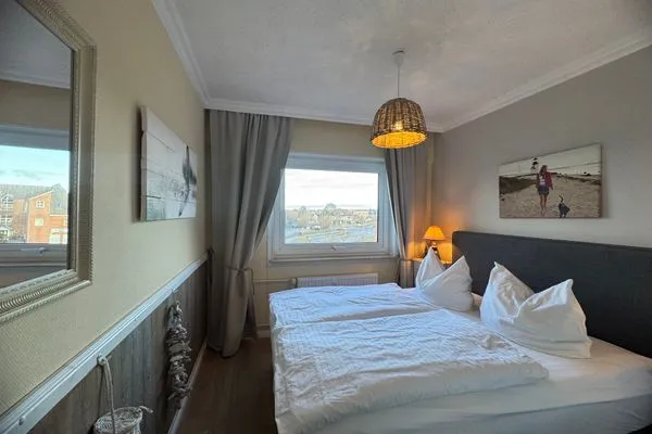 Schlafzimmer Ferienwohnung im Haus Nordland App 46