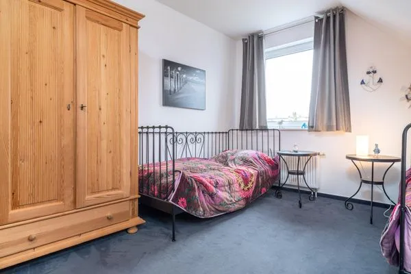 Schlafzimmer mit Einzelbetten in der 1. Etage  Ferienwohnung Ohana