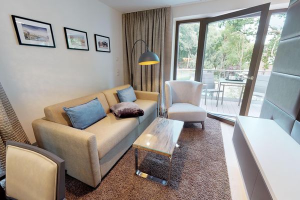 Luxusapartment mit eigener Sauna & Sonnenbalkon – nur Minuten vom Strand entfernt