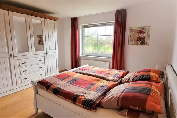 Schlafzimmer Fuhrmannshof Ferienwohnung Cassen