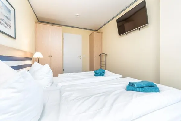 Schlafzimmer mit Doppelbett  Villa Kurpark - Wohnung 512