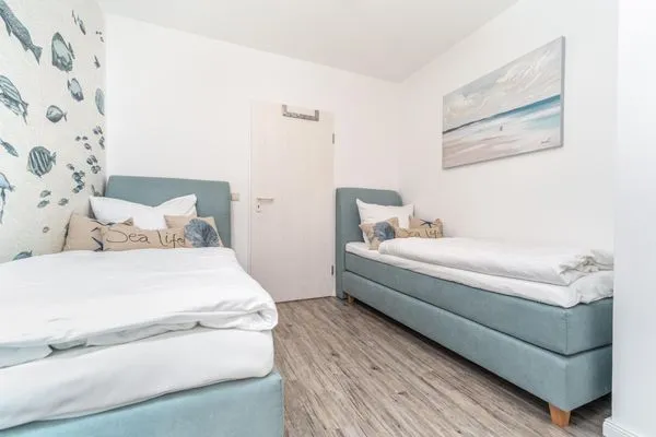 Schlafzimmer mit zwei Einzelbetten Parkresidenz am Hafen Wohnung HF 23 - "Viento"