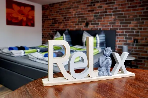 Relax - Dekoaufsteller spricht für sich  Ferienapartment Zur guten Quelle